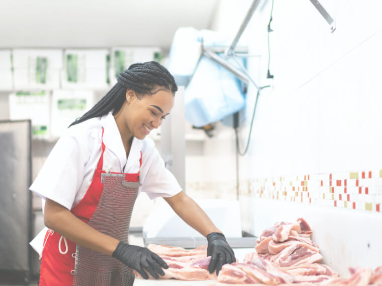 Butcher preparing meat